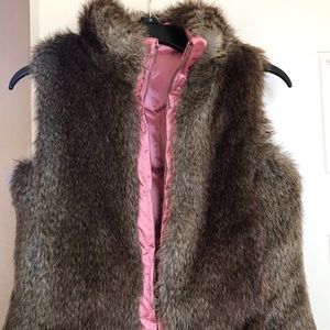 Gap, reversible girls vest.  Faux fur/Pink.  Size 8 (M) and like new condition.